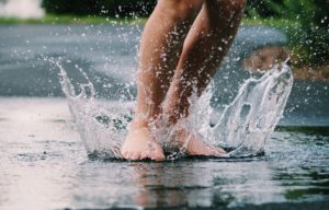 Feet splashing in water