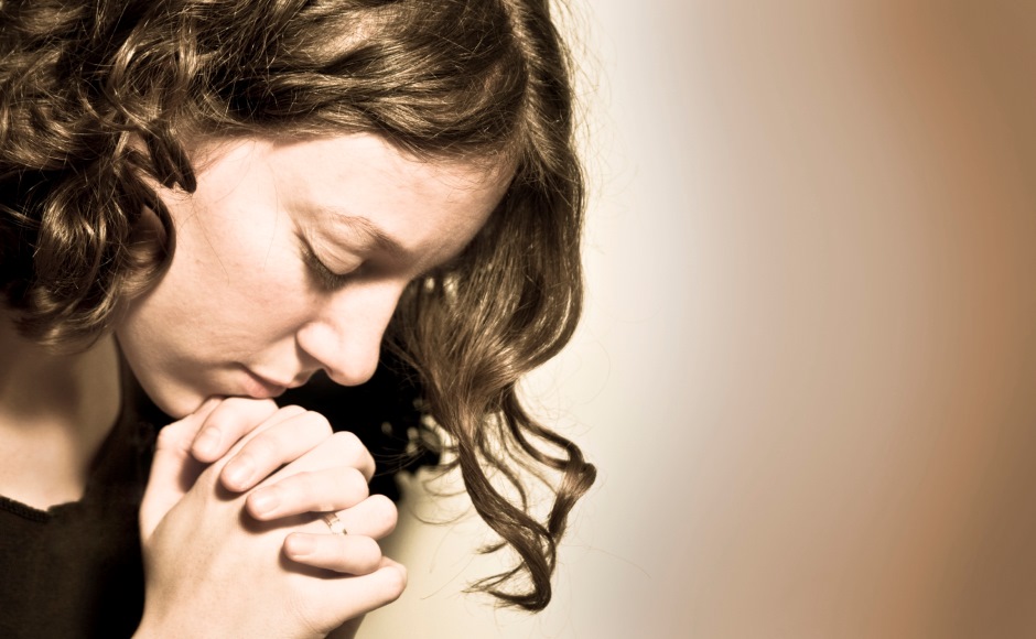 Young woman in prayer